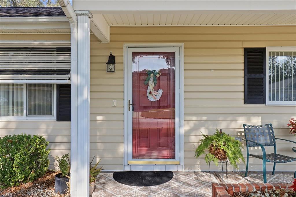 11263 Southwest 138th Lane Dunnellon, FL 34432 - Photo 2 of 53 a couple of potted plant in front of a door
