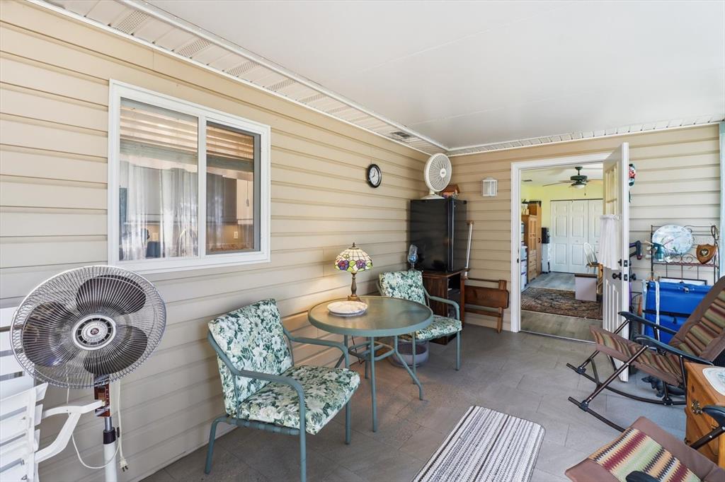 11263 Southwest 138th Lane Dunnellon, FL 34432 - Photo 23 of 53 a living room with furniture and a window
