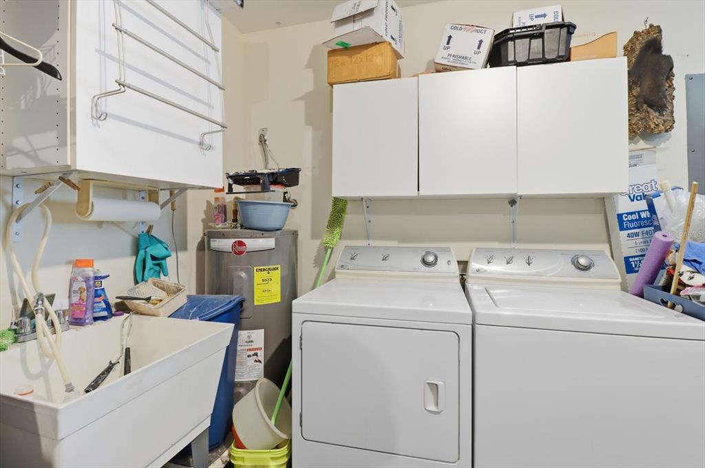 11263 Southwest 138th Lane Dunnellon, FL 34432 - Photo 25 of 53 a utility room with dryer and washer