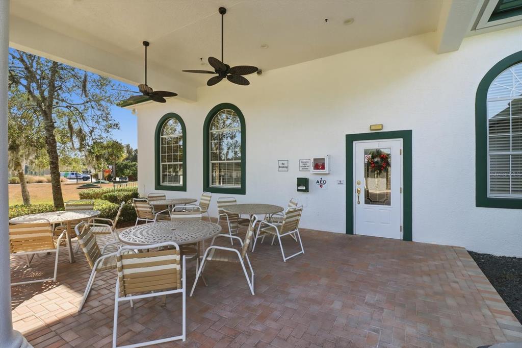 11263 Southwest 138th Lane Dunnellon, FL 34432 - Photo 46 of 53 a dining room with wooden floor a chandelier a wooden table and chairs