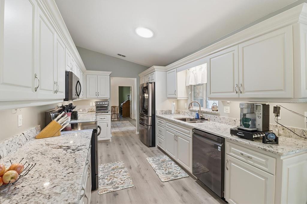 11263 Southwest 138th Lane Dunnellon, FL 34432 - Photo 9 of 53 a kitchen with a sink and cabinets