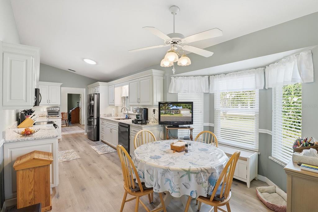 11263 Southwest 138th Lane Dunnellon, FL 34432 - Photo 10 of 53 a room with stainless steel appliances kitchen island granite countertop furniture and a kitchen view