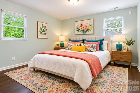 a bedroom with bed and wall painting with wooden floor