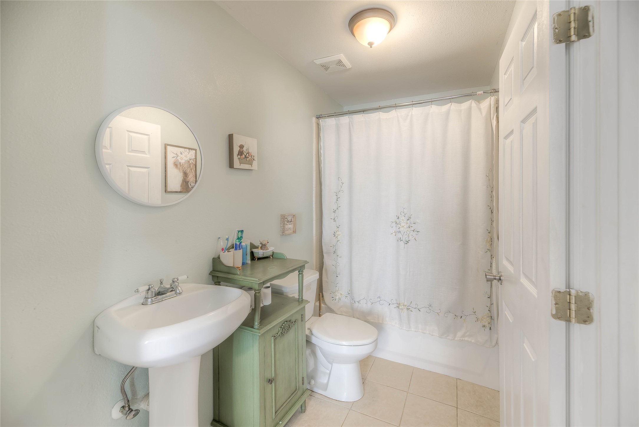110 Happy Trails Road Coldspring, TX 77331 - Photo 18 of 49 a bathroom with a sink a toilet and a mirror