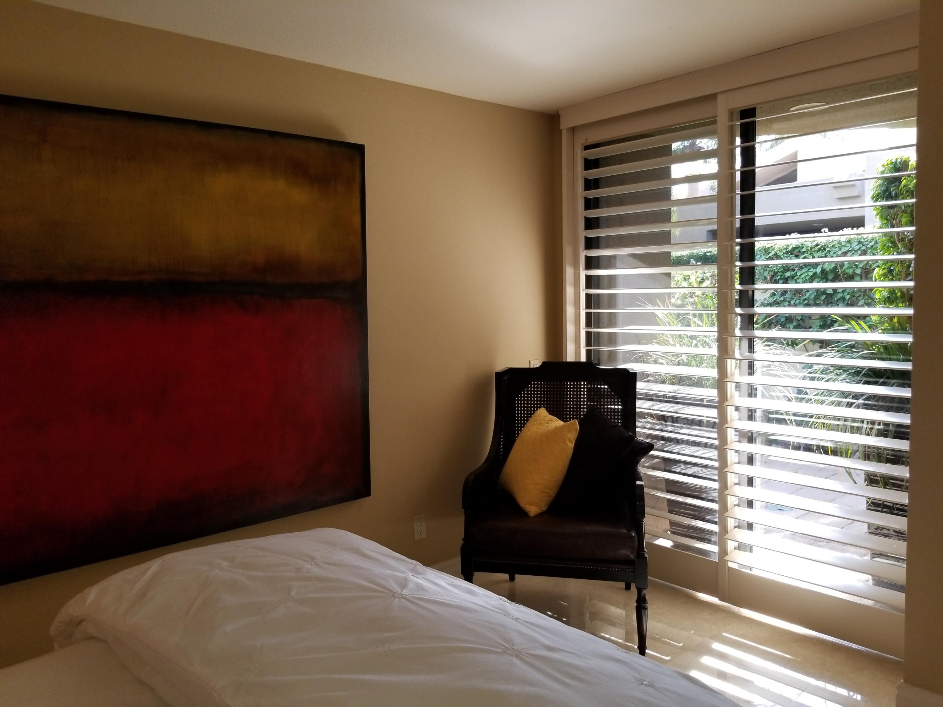 45735 Juniper Circle, Unit 522 Palm Desert, CA 92260 - Photo 24 of 53 a bedroom with a chair and a window