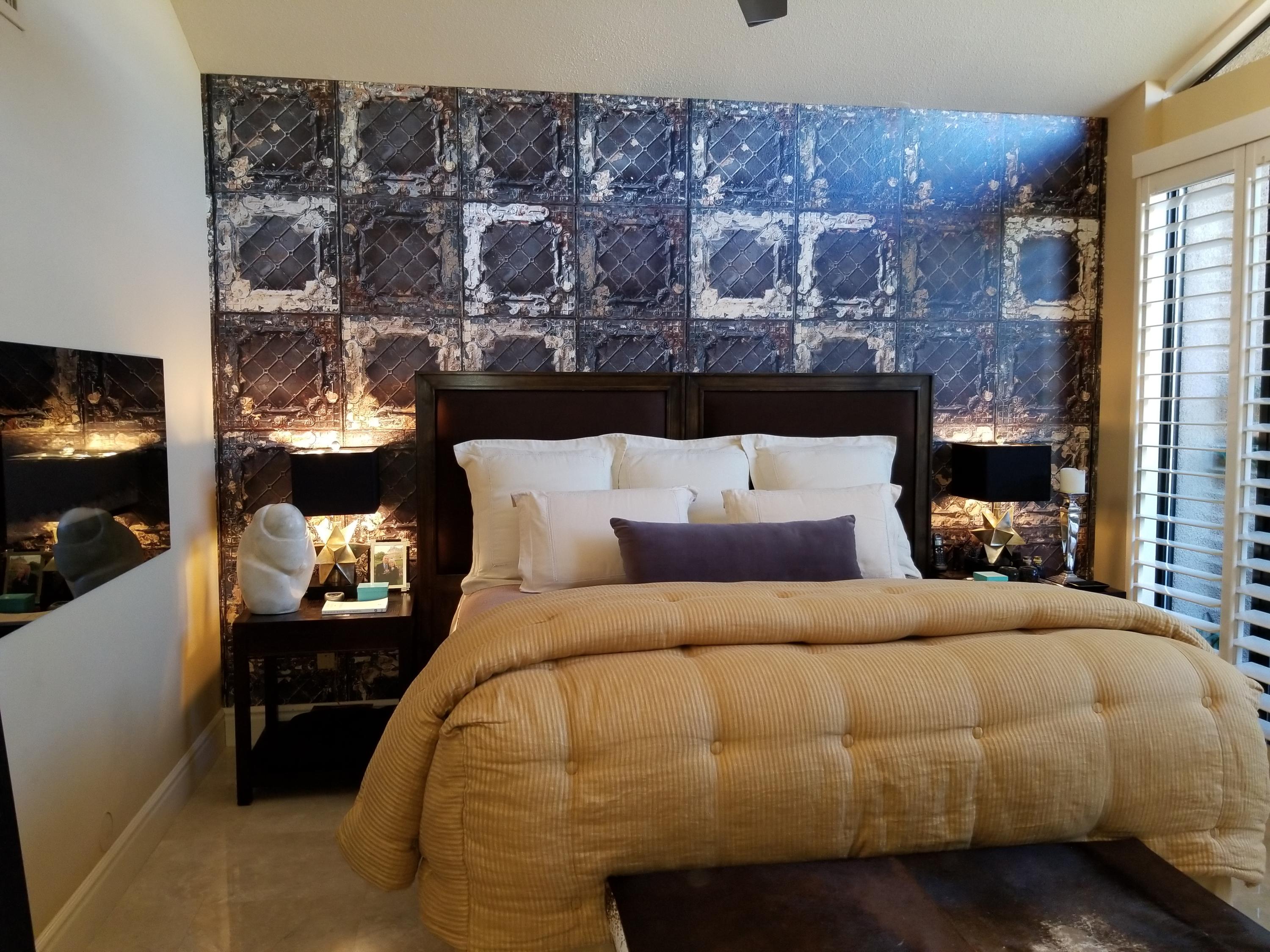 45735 Juniper Circle, Unit 522 Palm Desert, CA 92260 - Photo 32 of 53 a bedroom with a bed and lamp