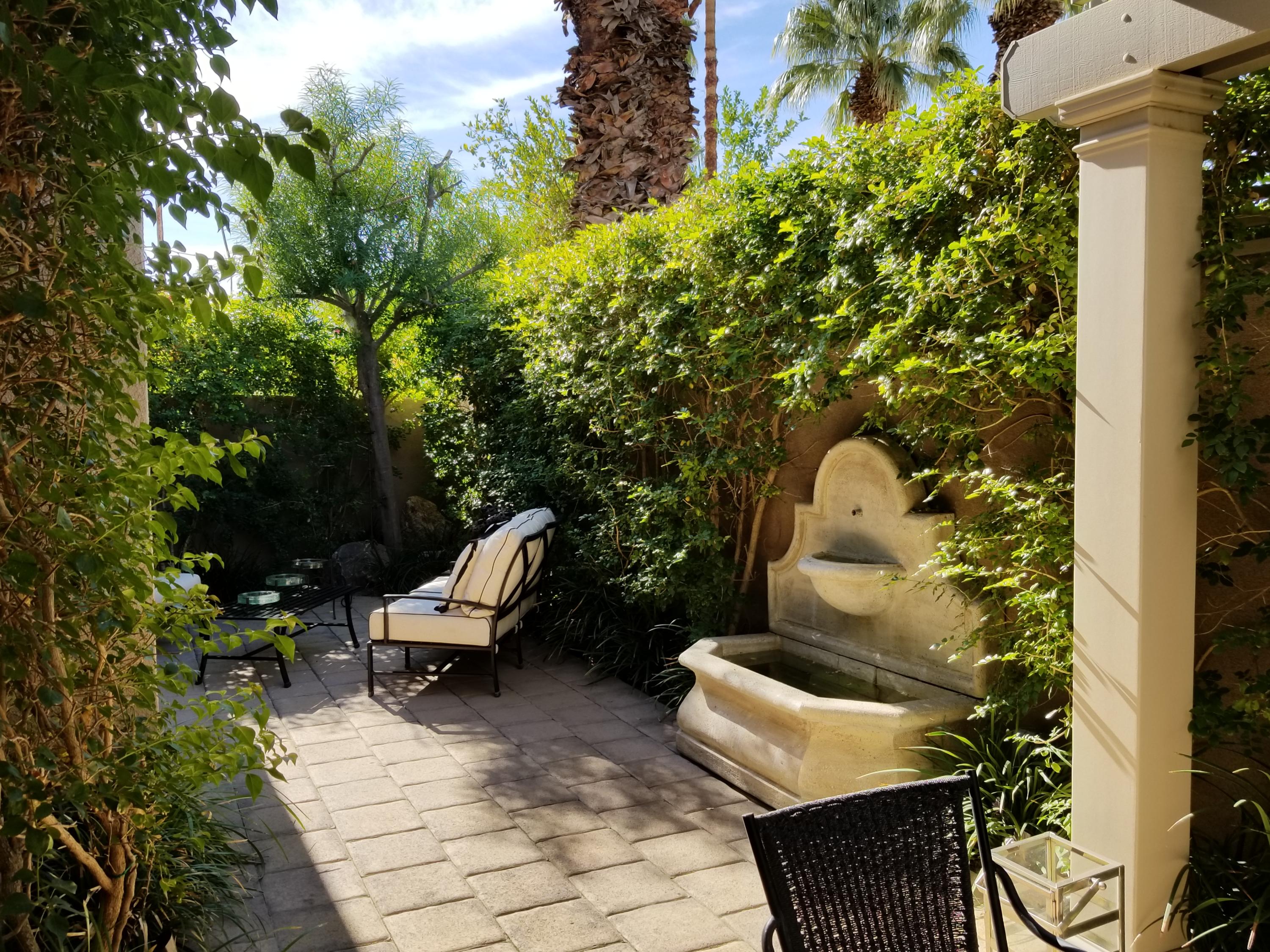 45735 Juniper Circle, Unit 522 Palm Desert, CA 92260 - Photo 39 of 53 a view of a patio in the backyard