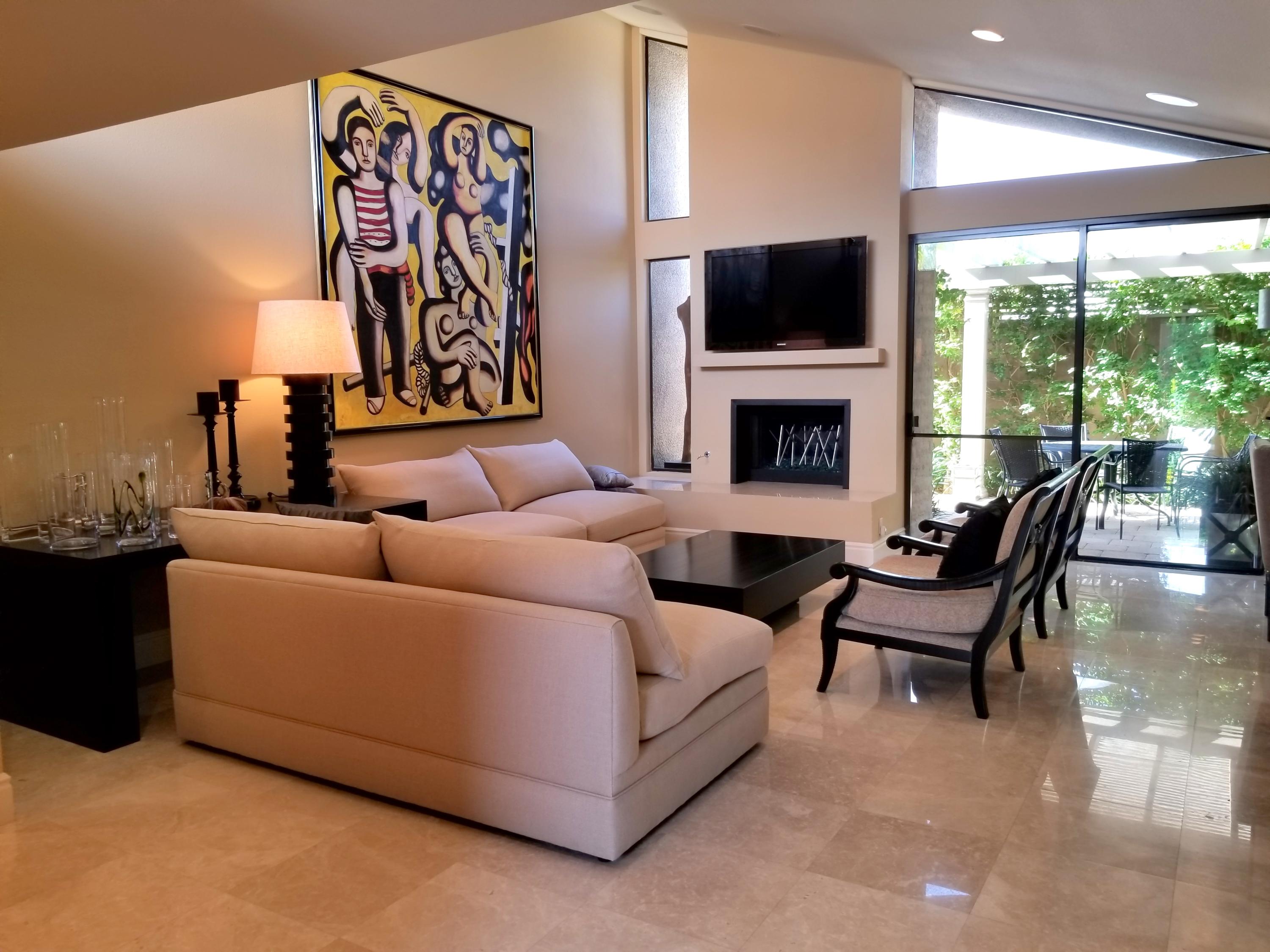 45735 Juniper Circle, Unit 522 Palm Desert, CA 92260 - Photo 5 of 53 a living room with furniture and a fireplace