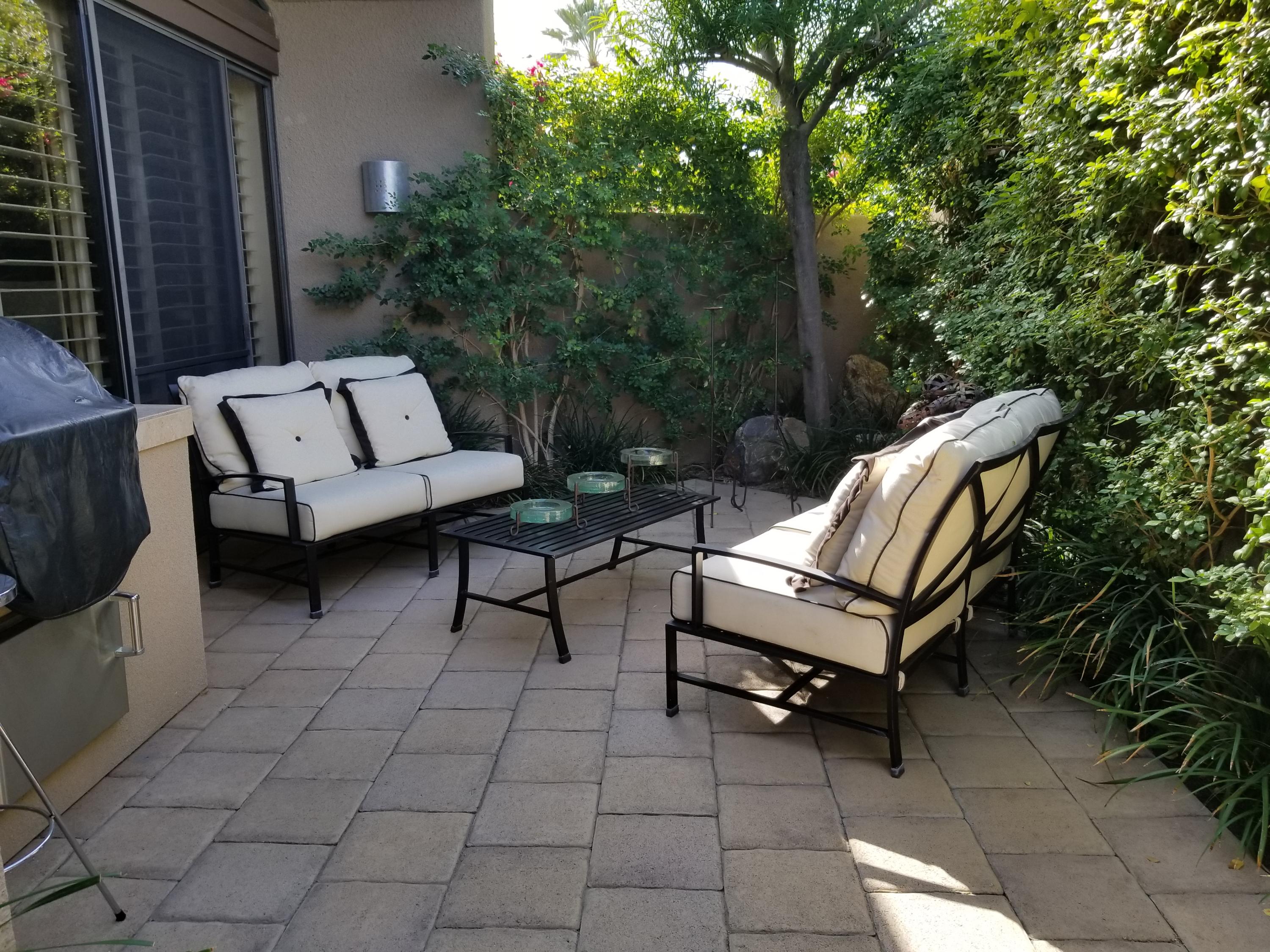 45735 Juniper Circle, Unit 522 Palm Desert, CA 92260 - Photo 42 of 53 a view of a two chairs in a patio