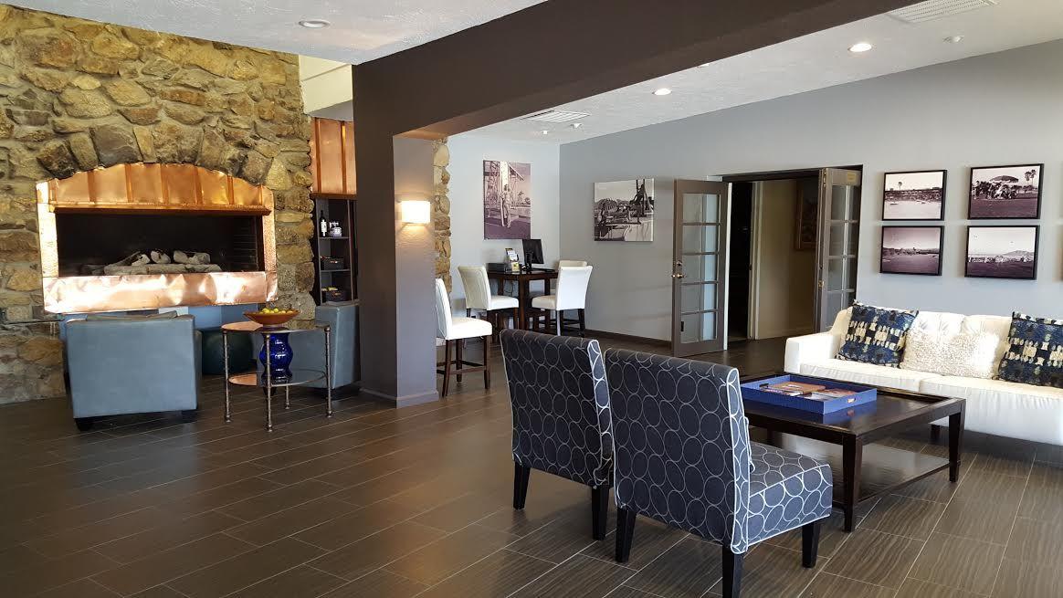 45735 Juniper Circle, Unit 522 Palm Desert, CA 92260 - Photo 51 of 53 a living room with furniture and a flat screen tv