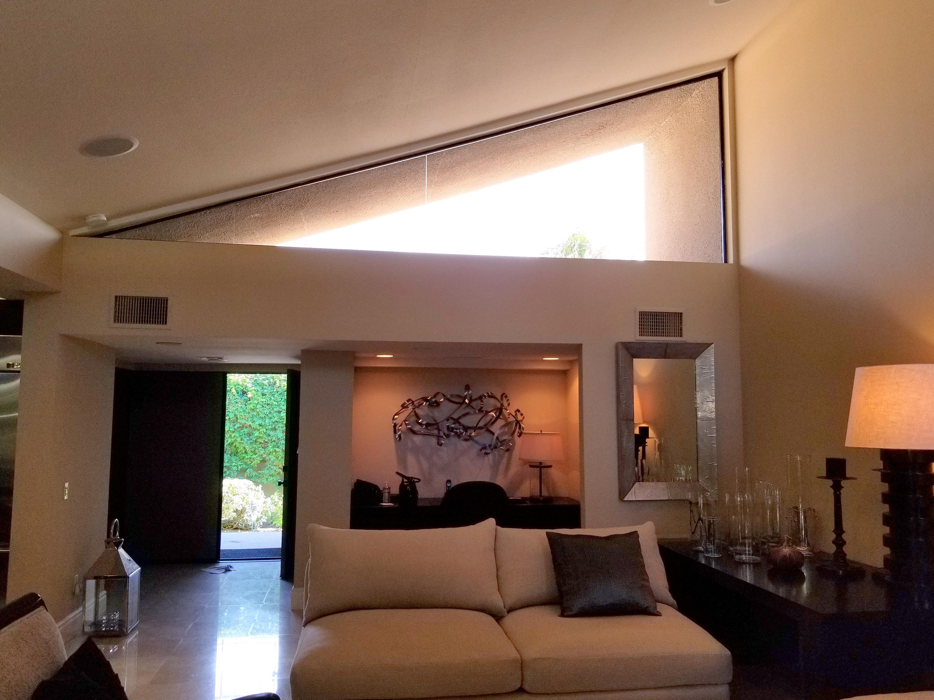 45735 Juniper Circle, Unit 522 Palm Desert, CA 92260 - Photo 8 of 53 a living room with furniture and a large window