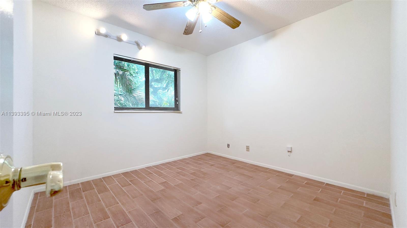 11412 Southwest 113th Place Miami, FL 33176 - Photo 14 of 16 an empty room with a window