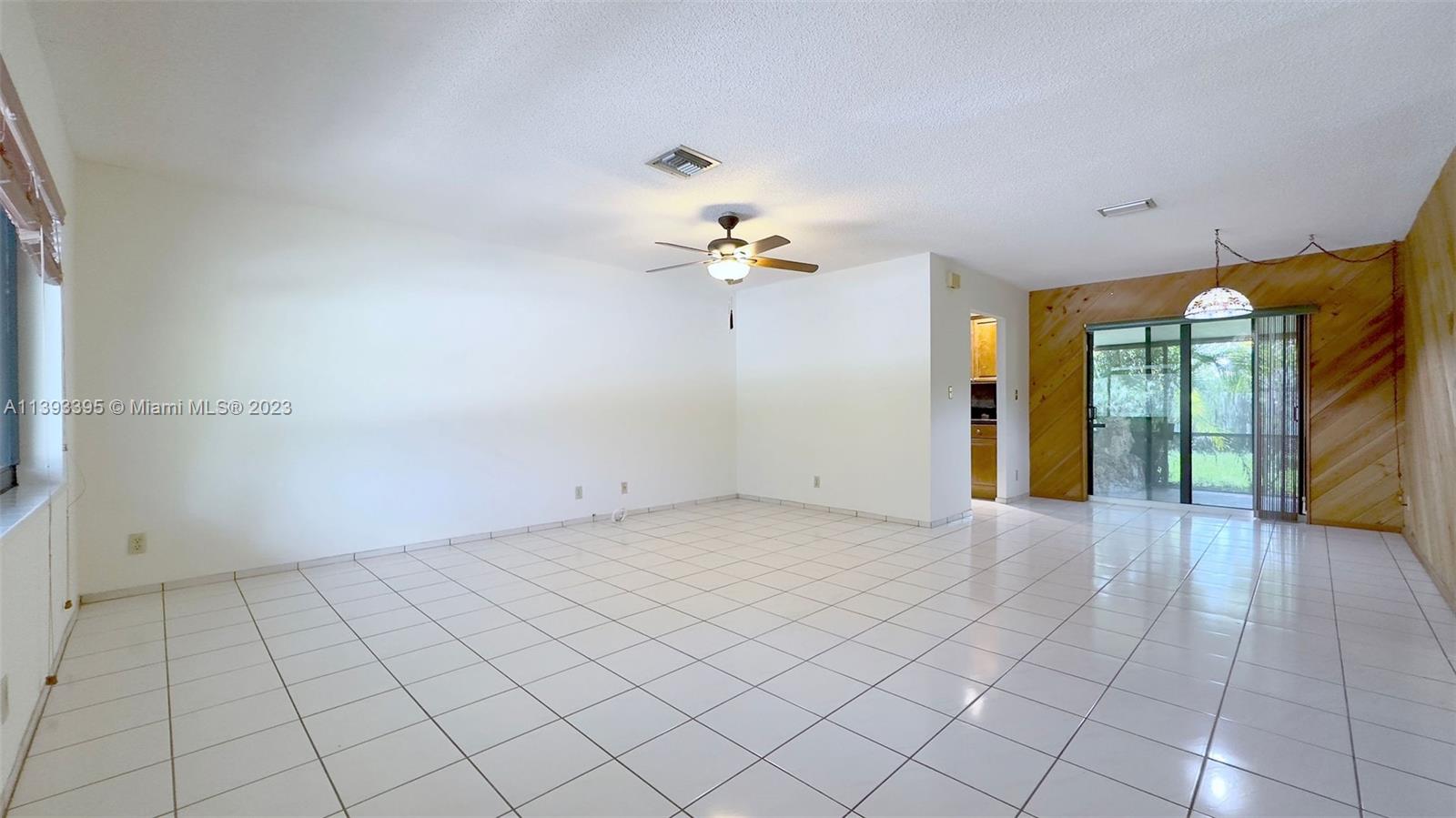 11412 Southwest 113th Place Miami, FL 33176 - Photo 4 of 16 a view of an empty room with a window