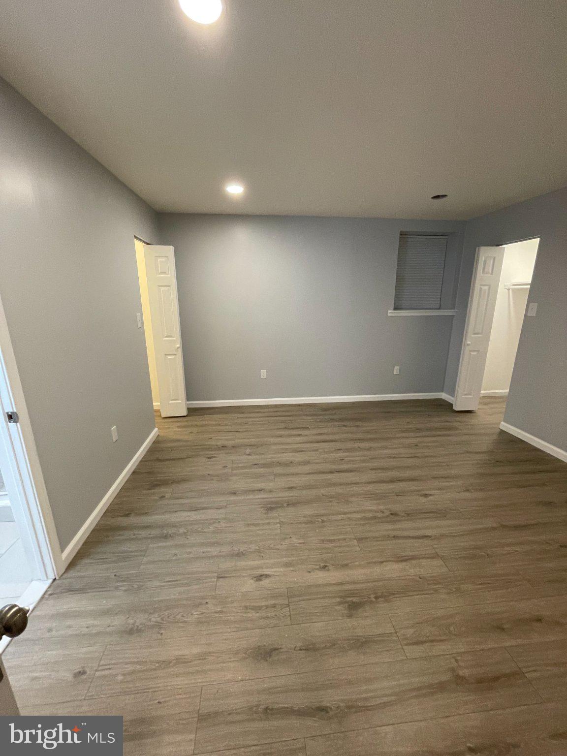 2016 Gatewood Place Silver Spring, MD 20903 - Photo 19 of 24 an empty room with wooden floor and windows