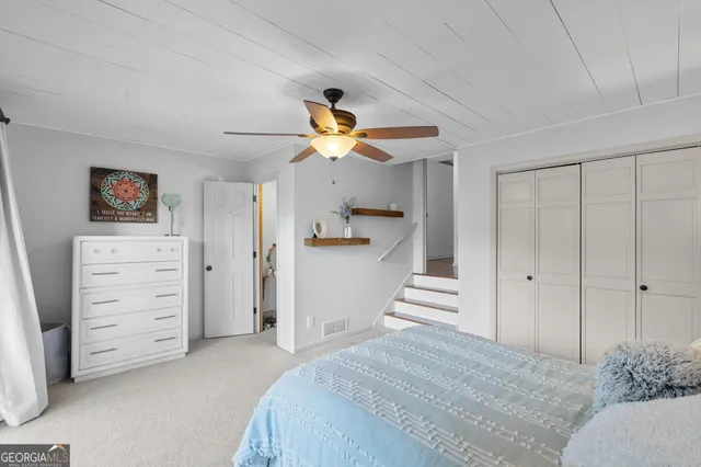 a bathroom with a granite countertop sink mirror and a bathtub