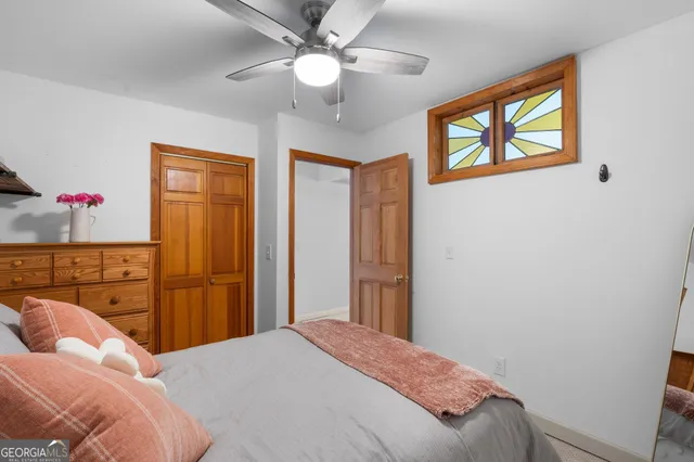 a view of a chairs and table on the wooden deck