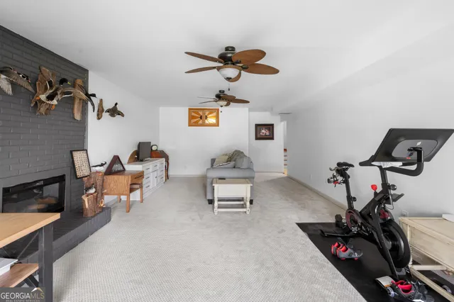 a view of a house with a big yard and large trees