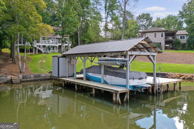 a view of a lake with a garden and trees