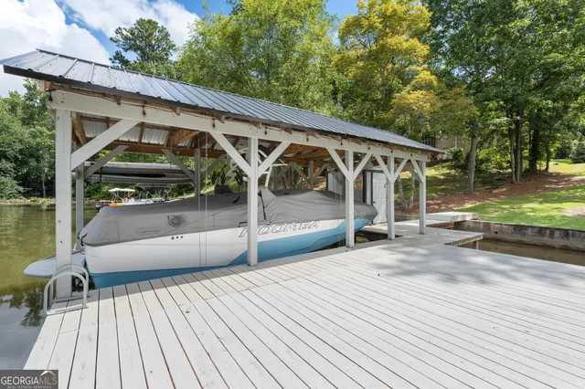 a front view of a house with a yard table and chairs