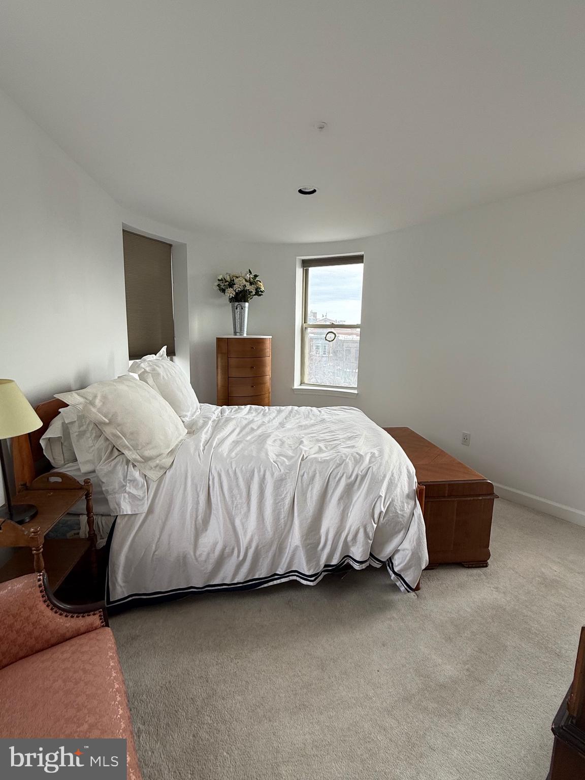 1801 Calvert Street Northwest, Unit 401 Washington, DC 20009 - Photo 13 of 23 a bedroom with a bed and window