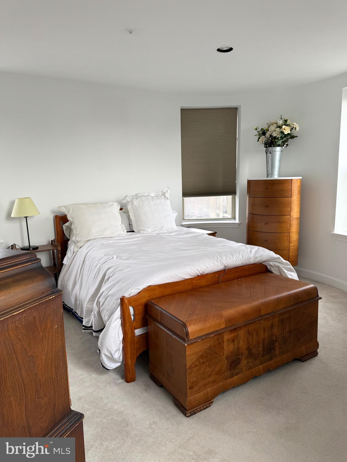 1801 Calvert Street Northwest, Unit 401 Washington, DC 20009 - Photo 16 of 23 a bedroom with a bed and window