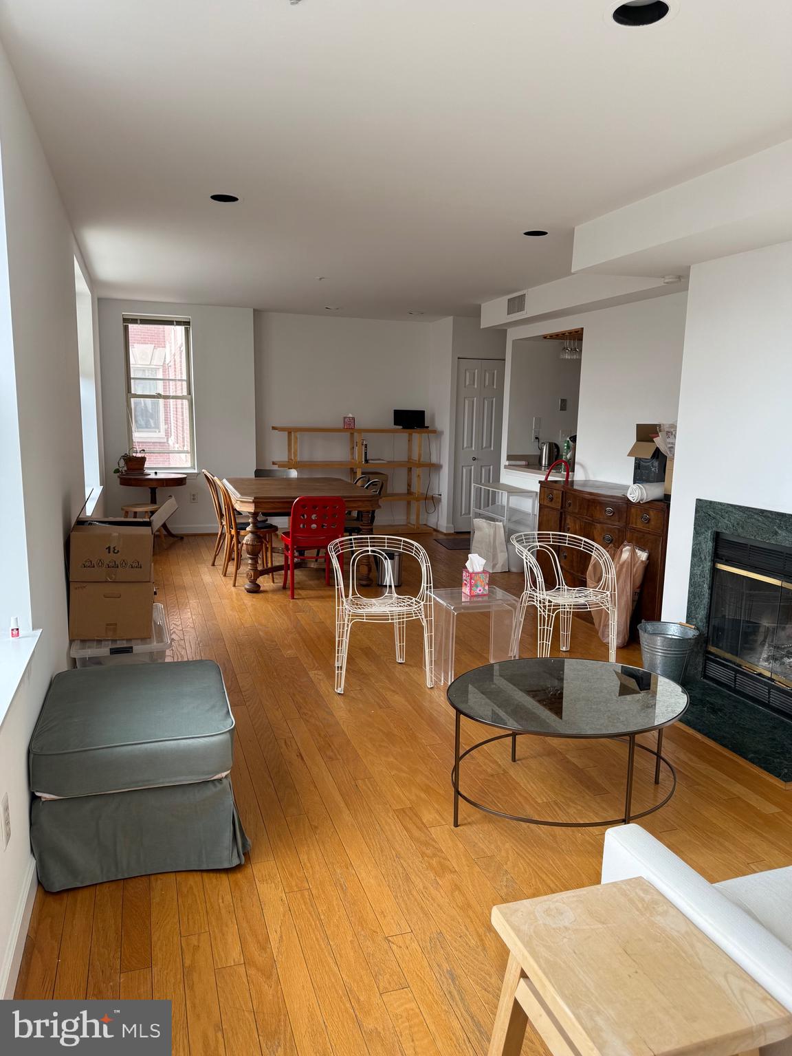 1801 Calvert Street Northwest, Unit 401 Washington, DC 20009 - Photo 19 of 23 a living room with furniture and a flat screen tv
