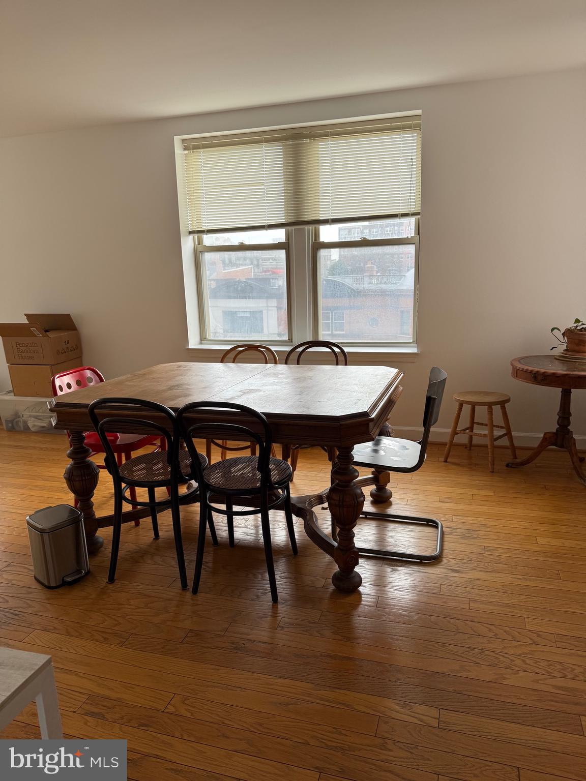 1801 Calvert Street Northwest, Unit 401 Washington, DC 20009 - Photo 21 of 23 a dining room with furniture and wooden floor