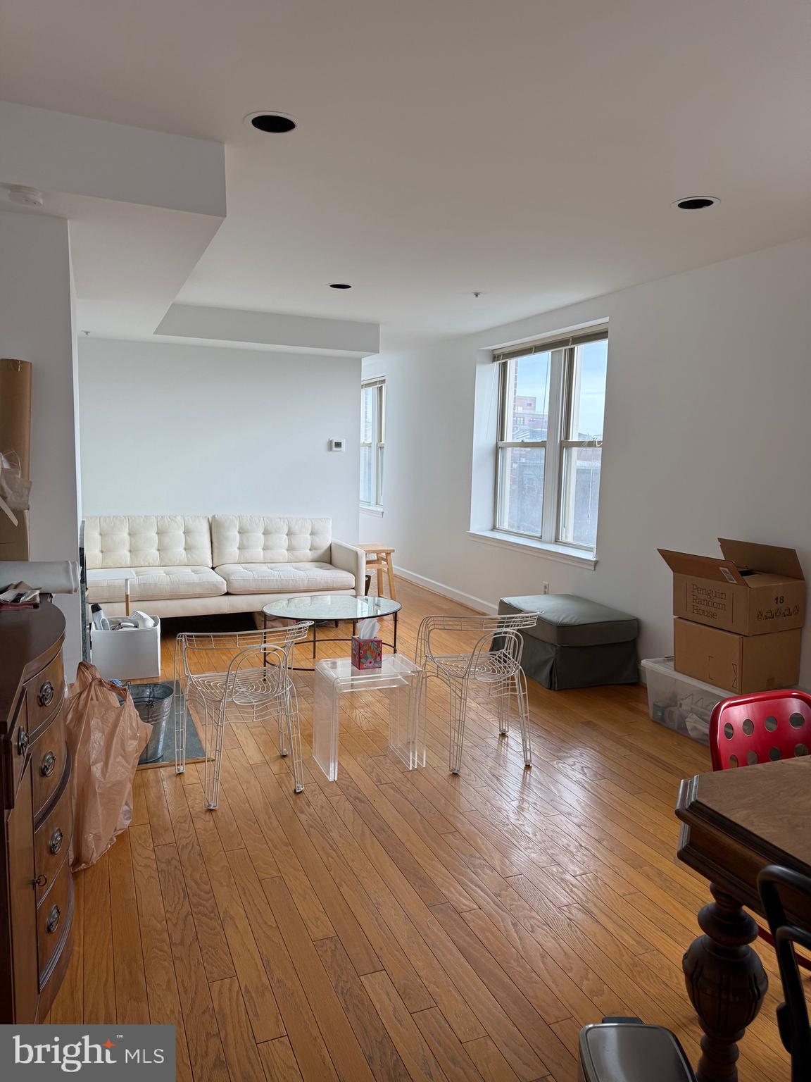 1801 Calvert Street Northwest, Unit 401 Washington, DC 20009 - Photo 22 of 23 a living room with furniture and a wooden floor
