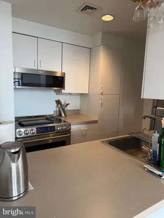 a kitchen with a stove and a sink
