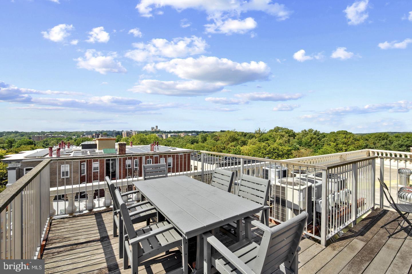 1801 Calvert Street Northwest, Unit 401 Washington, DC 20009 - Photo 7 of 23 a view of a balcony with table and chairs