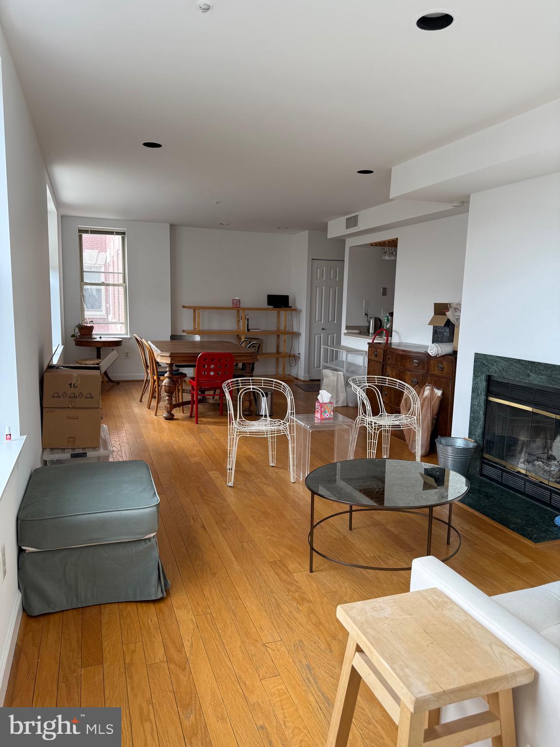 1801 Calvert Street Northwest, Unit 401 Washington, DC 20009 - Photo 9 of 23 a living room with furniture and a flat screen tv