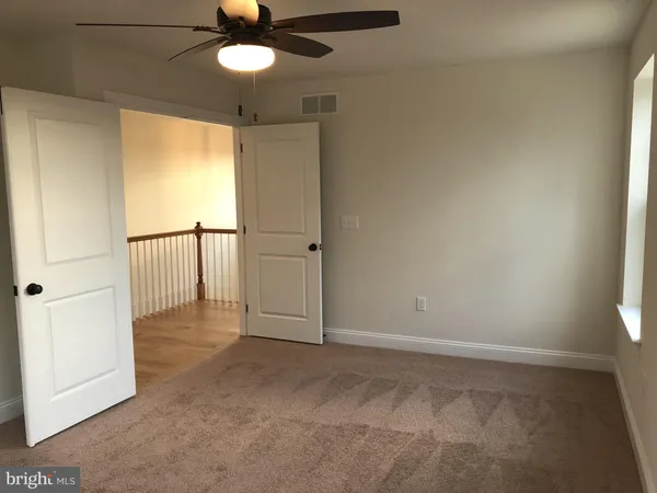 wooden floor in an empty room and a window
