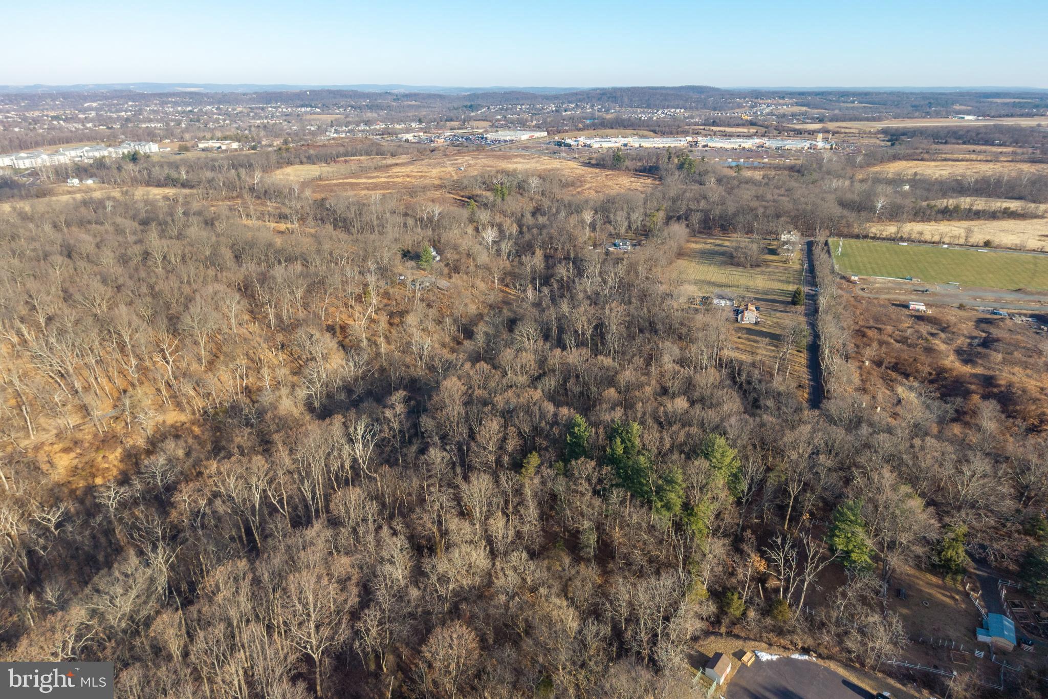 0 Sanatoga Road, Unit A Pottstown, PA 19464 - Photo 27 of 40 Expansive wooded landscape with distant hills.