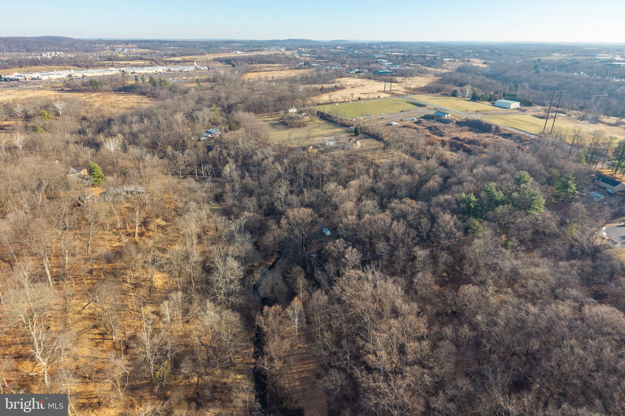 0 Sanatoga Road, Unit A Pottstown, PA 19464 - Photo 30 of 40 Expansive wooded landscape under clear skies.