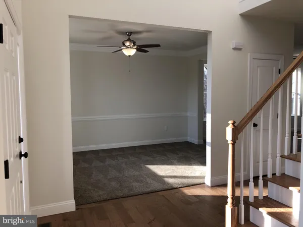 a view of a livingroom with a staircase