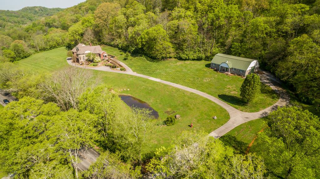 a view of a swimming pool with a yard