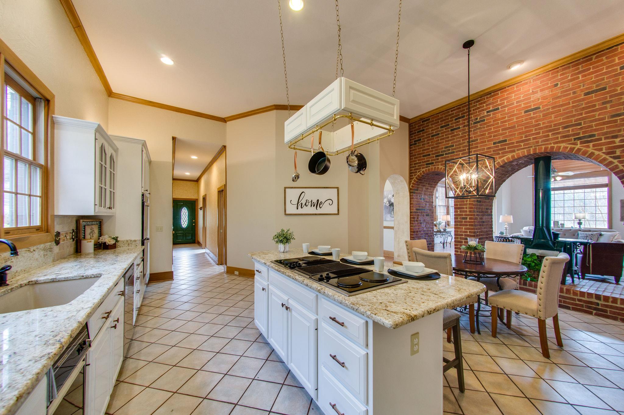 1026 Holly Tree Gap Road Brentwood, TN 37027 - Photo 12 of 27 a kitchen that has a lot of cabinets in it