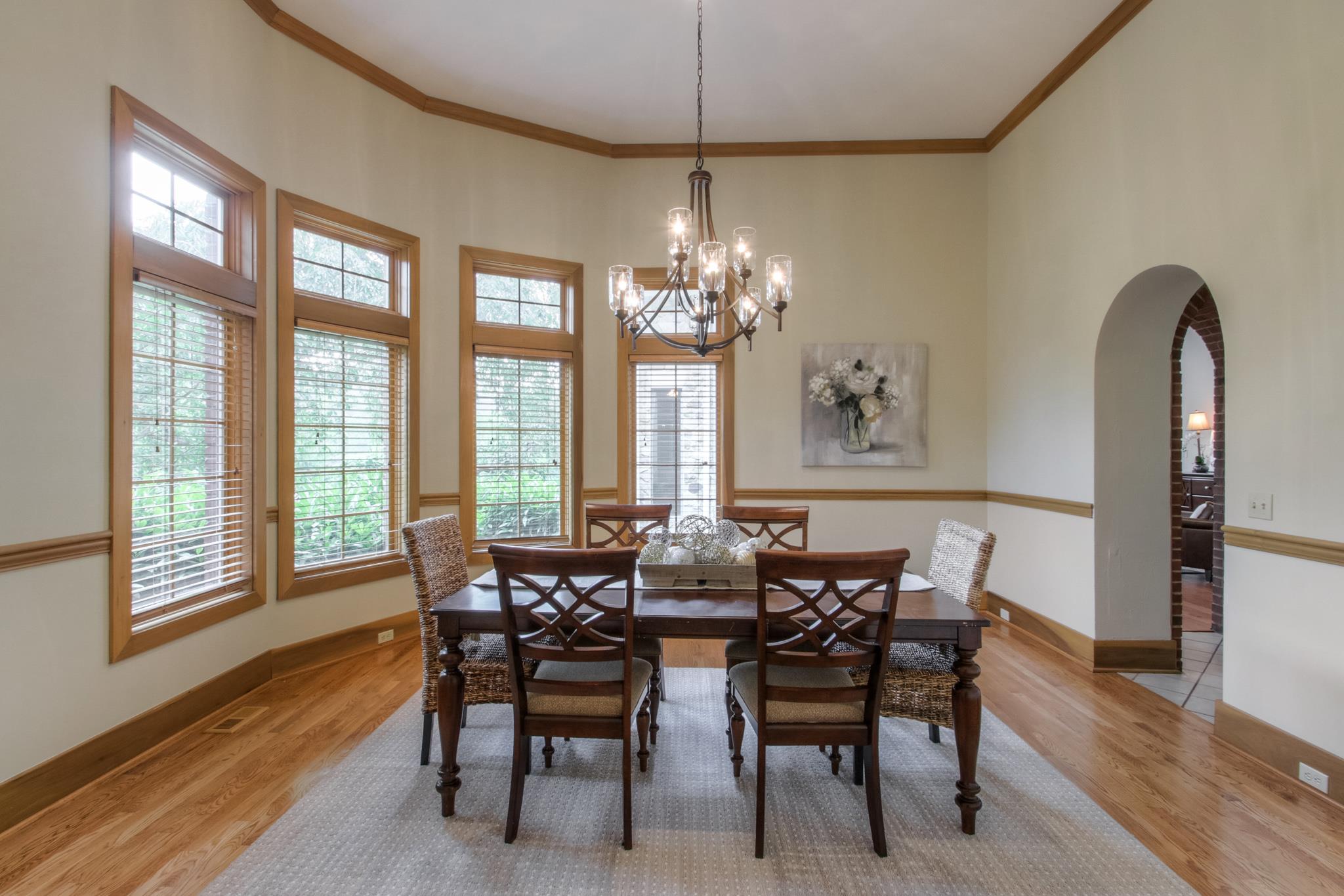 1026 Holly Tree Gap Road Brentwood, TN 37027 - Photo 13 of 27 a view of a dining room with furniture and wooden floor