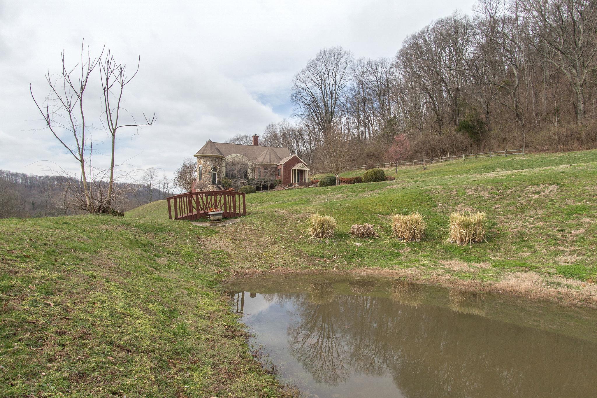 1026 Holly Tree Gap Road Brentwood, TN 37027 - Photo 4 of 27 a view of a lake with a yard