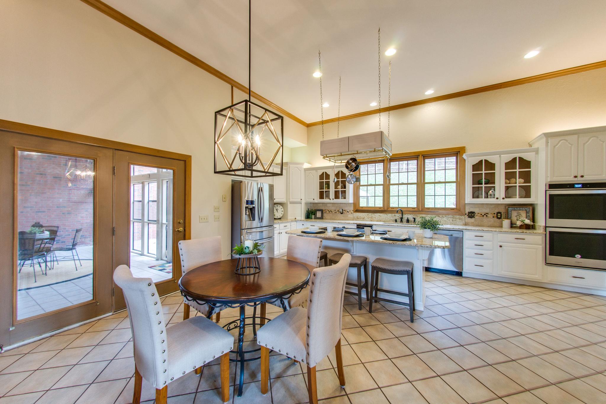 1026 Holly Tree Gap Road Brentwood, TN 37027 - Photo 9 of 27 a view of a dining room with furniture
