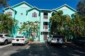a view of multiple houses with a yard