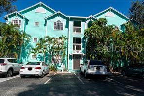 a view of multiple houses with a yard