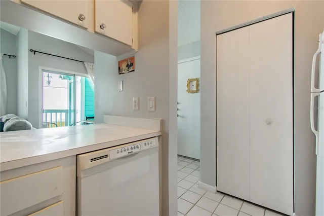 a kitchen with a sink and a refrigerator