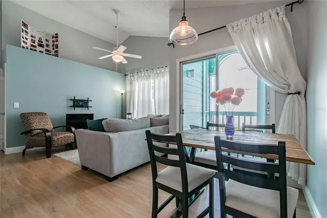 a view of a livingroom with furniture window and wooden floor