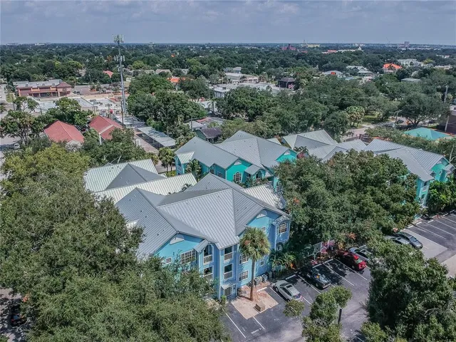 an aerial view of a house with a garden