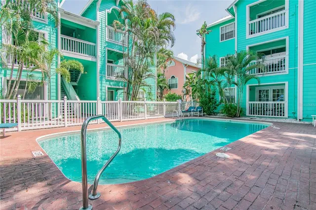 a view of a swimming pool with a garden and plants