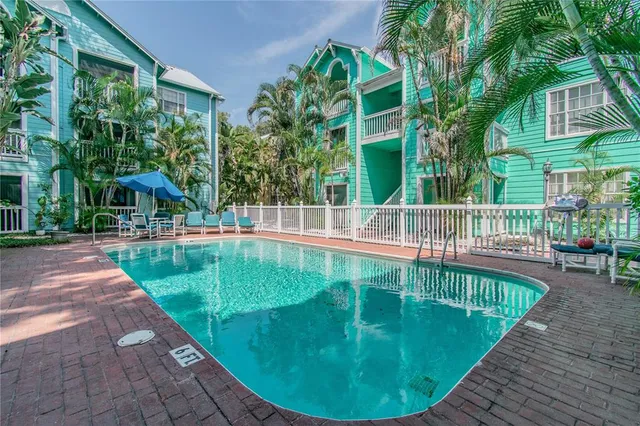 a view of a swimming pool with sitting area