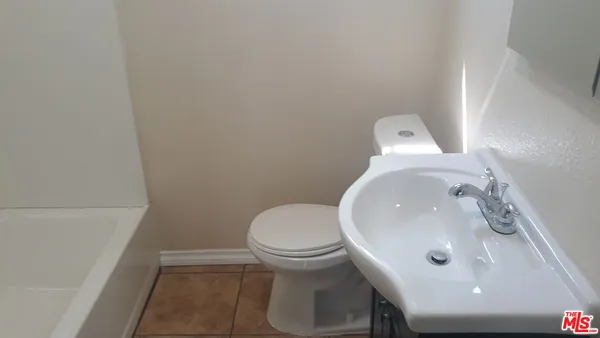 a bathroom with a sink and a toilet