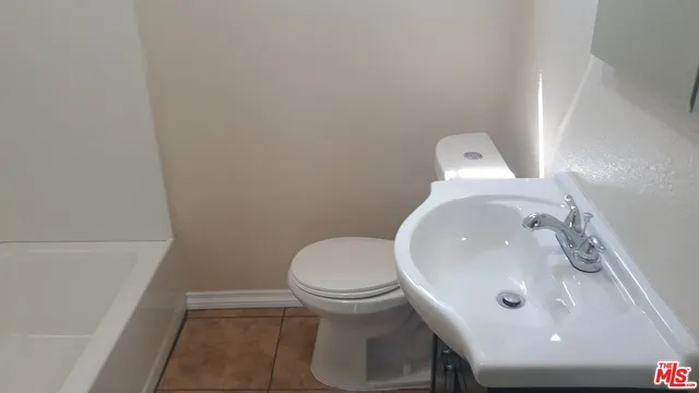 a bathroom with a sink and a toilet