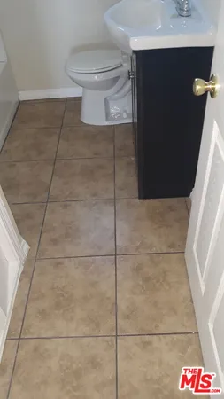 a bathroom with a sink and toilet